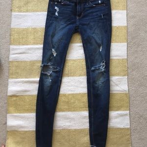 dark hollister ripped jeans!!